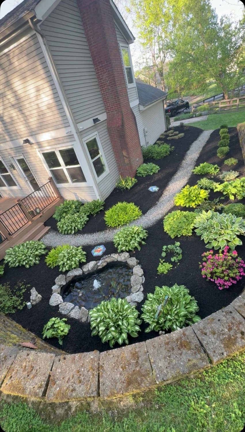 Finished residential landscape bed by Mercer Landscaping